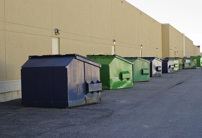 a series of colorful, utilitarian dumpsters deployed in a construction site in Bath PA